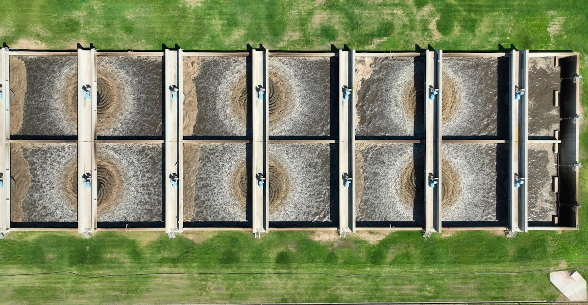 Close-up of industrial wastewater treatment components arranged in a workshop